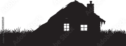 Silhouette of a Thatched Roof Cottage in Grass