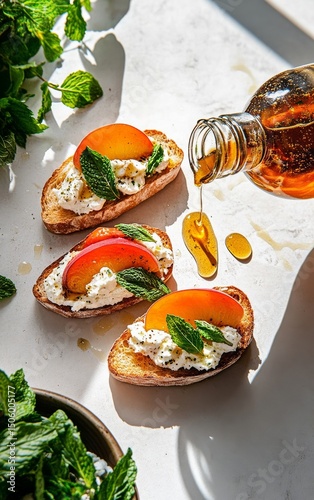 Delicious Crostini Topped With Fresh Peach Slices and Mint Drizzled With Honey