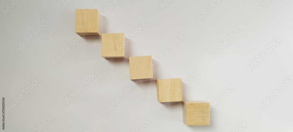 Fototapeta premium Stacked wooden blocks arrangement minimalist setting conceptual design creative display neutral background artistic perspective