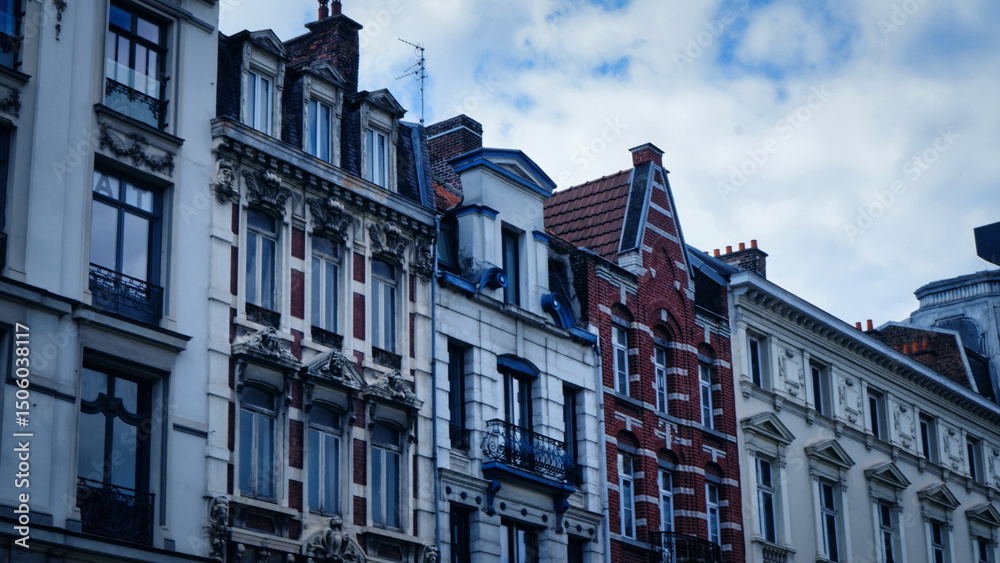 Fototapeta premium Vieux Lille old town quarter with empty narrow cobblestone street, paving stone square with old colorful buildings in historical city centre, French Flanders, Hauts-de-France Region, Northern France