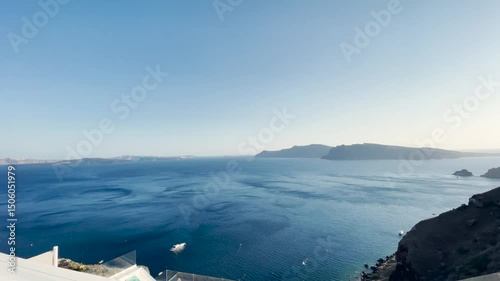 Midday Panoramic View of Oia, Santorini – Cliffside Village in Bright Sunlight