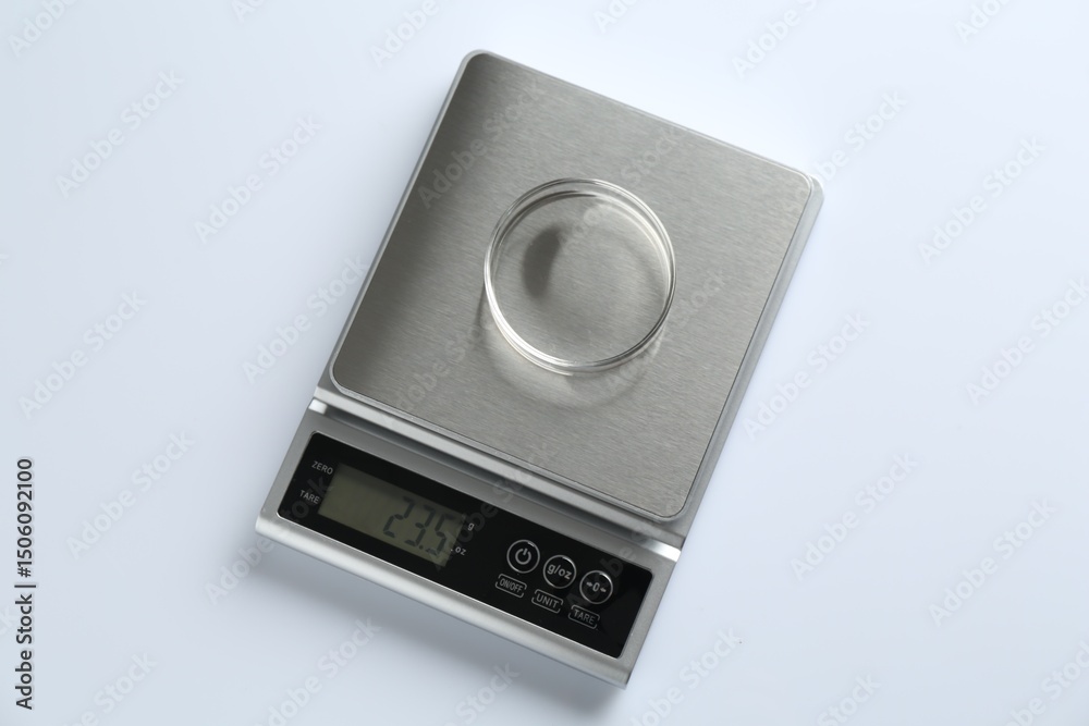 Fototapeta premium Laboratory scale with Petri dish on white background, top view