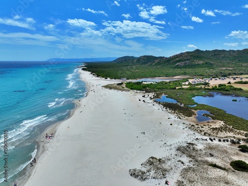 Fototapeta Naklejka Na Ścianę i Meble -  Aerial view of Berchida beach south of Siniscola, in the Baronie territory on the east coast of Sardinia island is known as one of the most beautiful beaches in the Mediterranean for its purest waters