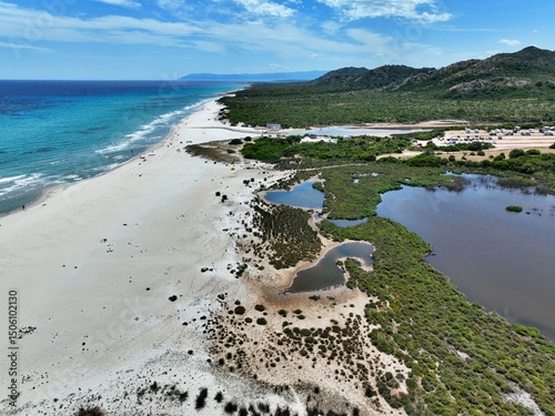 Fototapeta Naklejka Na Ścianę i Meble -  Aerial view of Berchida beach south of Siniscola, in the Baronie territory on the east coast of Sardinia island is known as one of the most beautiful beaches in the Mediterranean for its purest waters