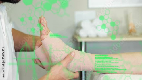 Physical therapist supporting foot and wrapping elastic bandage in figure eight for ankle support