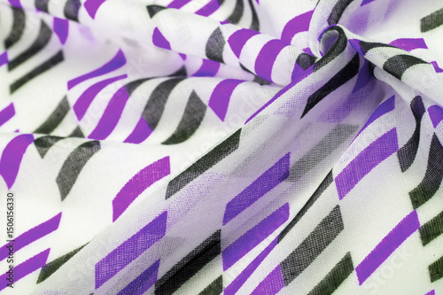Texture. Background. Template. White silk fabric with purple and black geometric rhombus shapes. violet, violaceous