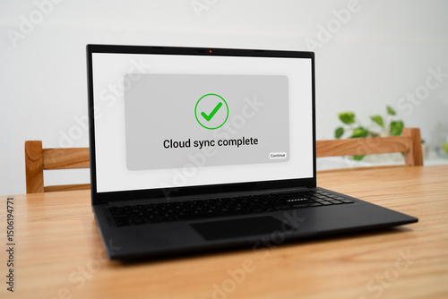Cloud sync complete notification on computer screen. Concept of syncing data from cloud storage.