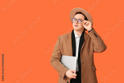 Young man in hat, coat and ...