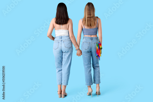 Young lesbian couple holdin...