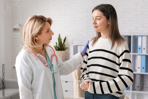Female doctor working with ...