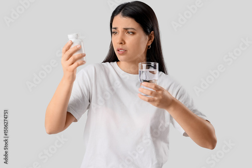 Young woman with glass of w...