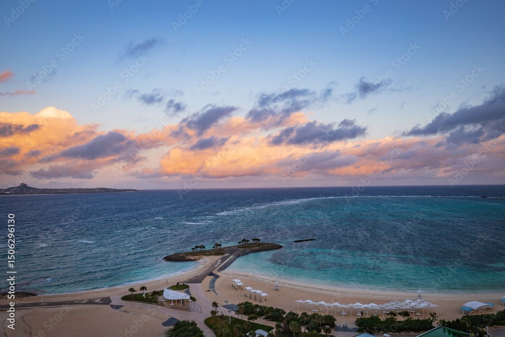 Obraz premium Panoramic View of Emerald Beach and Island at Sunset, Okinawa, Japan
