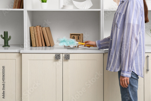 Young woman with pp-duster ...