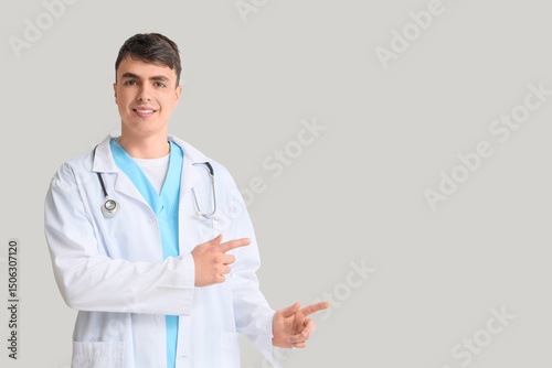 Male doctor pointing at som...