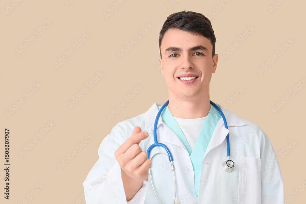 Male doctor making heart gesture on beige background, closeup Male doctor making heart gesture on beige background, closeup