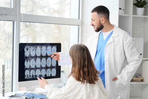 Male doctor showing MRI sca...