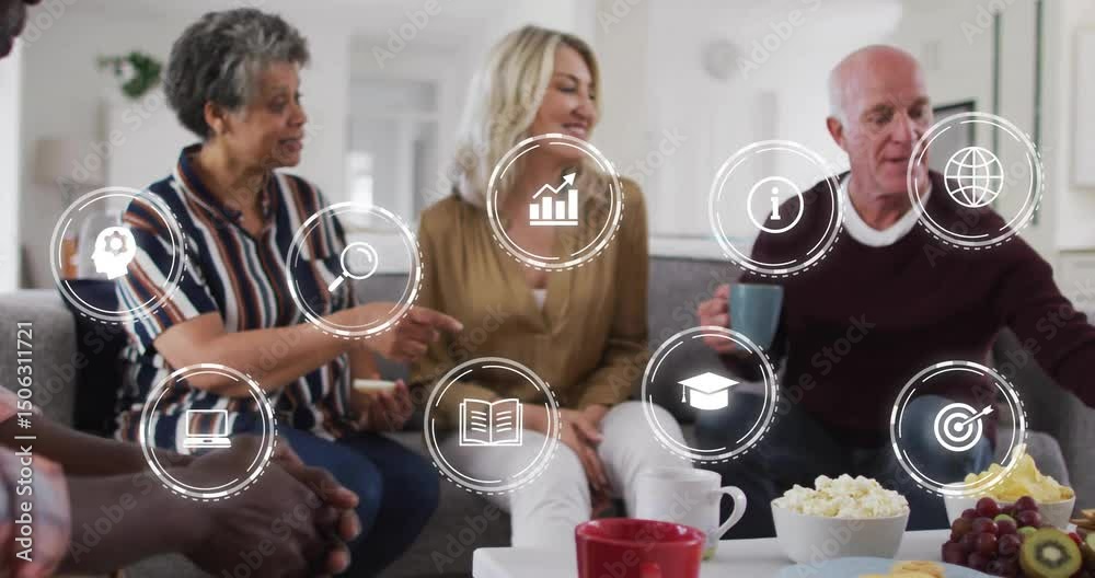 Friends snacking on gray sofa while digital icons fading in sparking technology learning chat