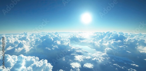 High-altitude view of puffy white clouds against a vibrant blue sky, sun prominent