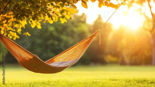 A peaceful hammock swaying gently in the sunlight, surrounded by lush greenery, perfect for relaxation and unwinding in nature.