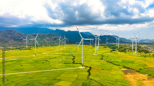Panoramic view of wind farm or wind park. Wind turbines generating electricity on rice field at Phan Rang, Ninh Thuan, Vietnam. Clean energy concept