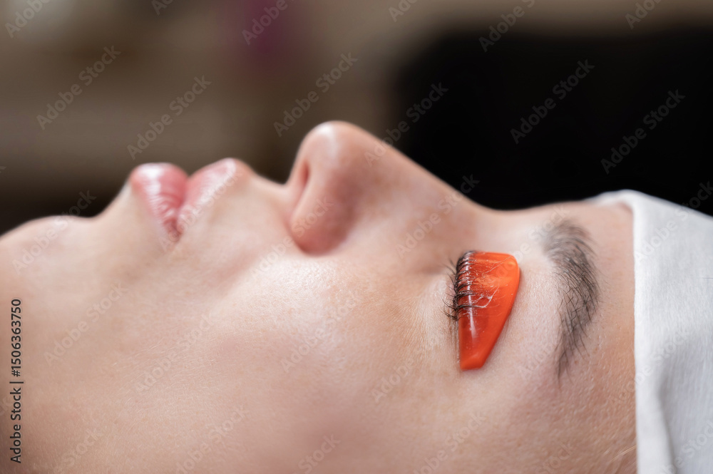 Fototapeta premium Caucasian woman undergoing eyelash lamination procedure.