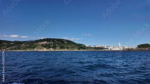 Coastal City View from a Moving Boat at Sea