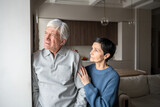 Old couple problems, trust issues. Confused pensive senior man avoid talking, wife hugging and consoling, elderly relationship tension suffering, marital support, health issues in family, empathy bond
