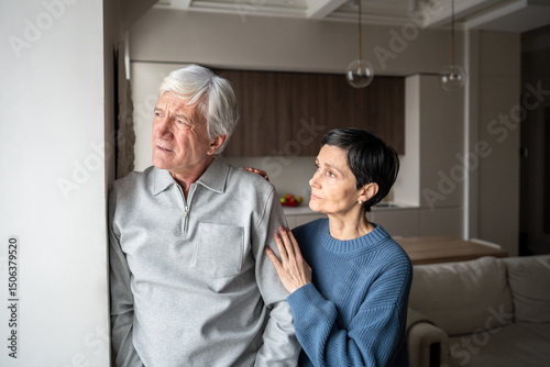 Old couple problems, trust issues. Confused pensive senior man avoid talking, wife hugging and consoling, elderly relationship tension suffering, marital support, health issues in family, empathy bond