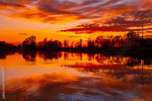 Spring sunset or sundowner view with reflections near Plattling, Isar, Deggendorf, Bavaria, Germany
