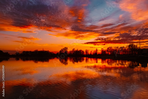 Spring sunset or sundowner view with reflections near Plattling, Isar, Deggendorf, Bavaria, Germany