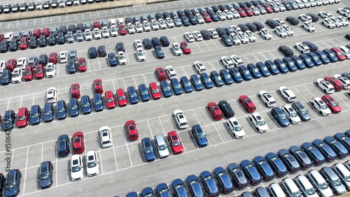 The vast, neatly arranged rows of cars exemplify the precision needed in managing large fleets, whether for dealership purposes or rental services, with an emphasis on order and accessibility.

