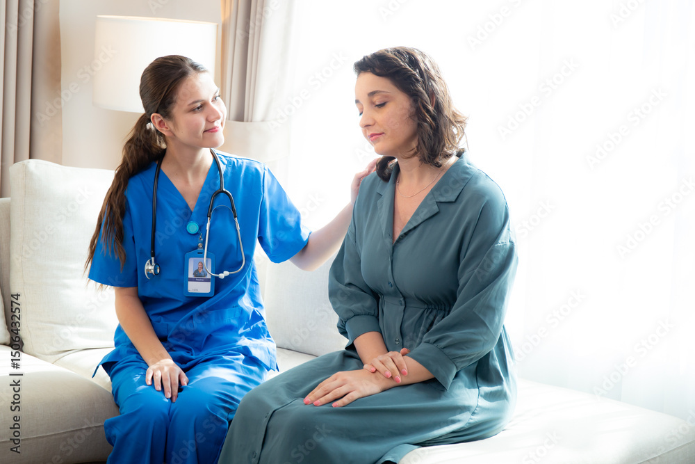 Fototapeta premium Caregiver caucasian young nurse woman comforting patient woman with stress and concern, doctor encourage and consoling patient with cancer while worry and sadness, medical and insurance.