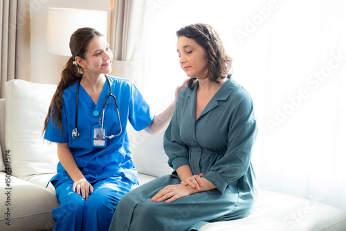 Caregiver caucasian young nurse woman comforting patient woman with stress and concern, doctor encourage and consoling patient with cancer while worry and sadness, medical and insurance.