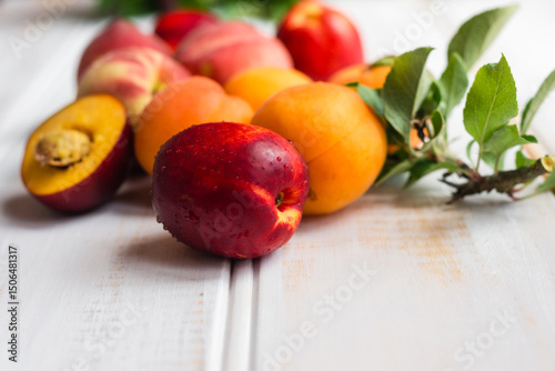 stone fruits on a wooden white vj background photo
