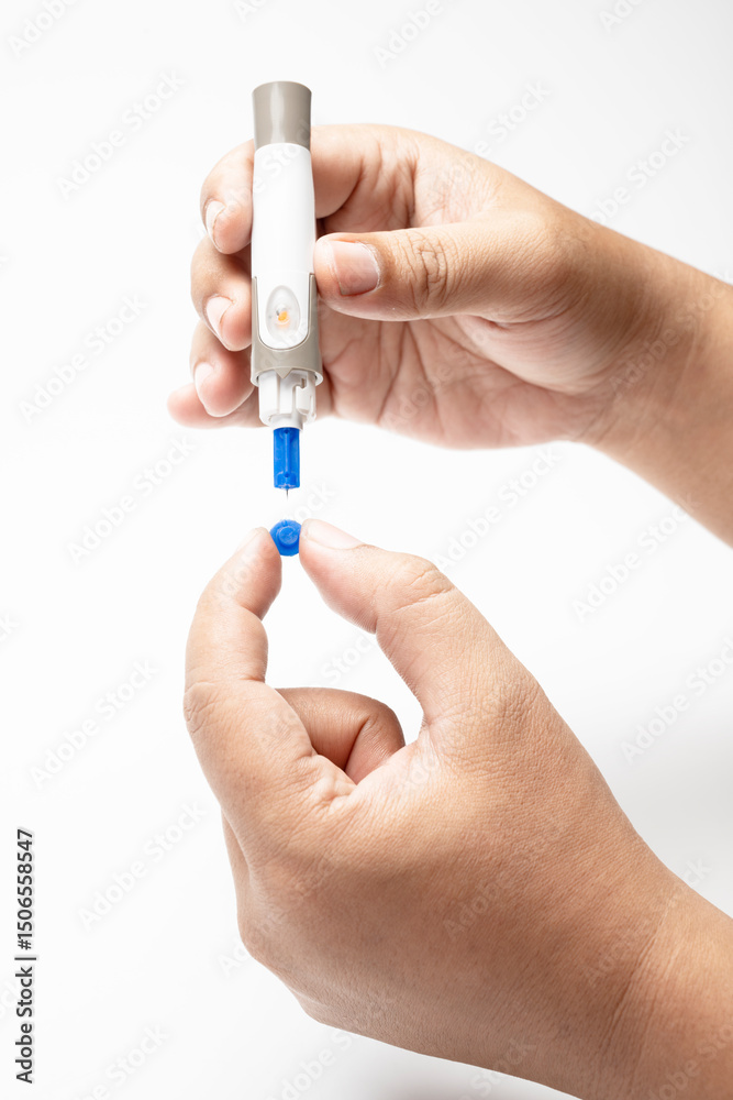 Human hand holding lancet with disposable syringe for checking blood sugar level isolated over a white background. Concept of diabetes or a healthy lifestyle Human hand holding lancet with disposable syringe for checking blood sugar level isolated over a white background. Concept of diabetes or a healthy lifestyle
