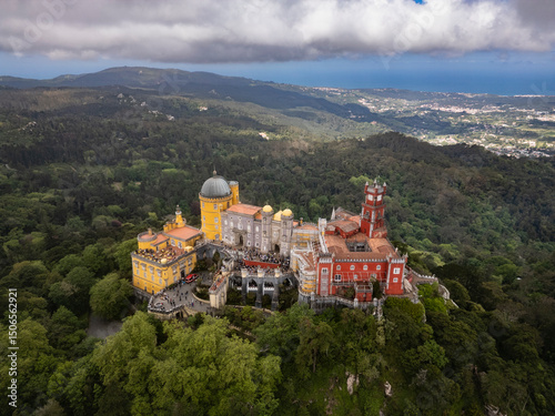 Beautiful aerial view to old historic colorful castle in green hill photo