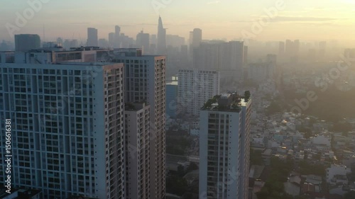 Ho Chi Minh City, Vietnam May 26,2025 4k aerial video of District 4 skyline, downtown of Ho Chi Minh City during sunrise