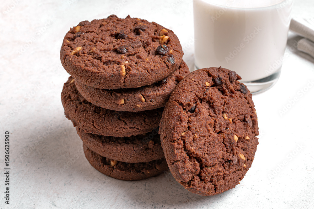 Fototapeta premium Stack of Chocolate chip cookies and glass of milk