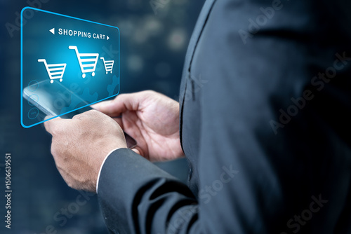 Businessman with cellphone showing shopping cart icon on the screen. Technology innovation on the virtual screen. Concept of online shopping and e-commerce business