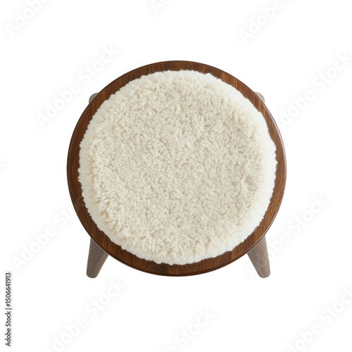 Top View of a Round Wooden Stool with a Fluffy White Sheepskin Seat Pad