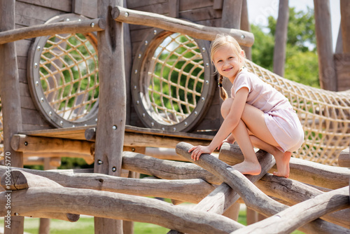 
Playground Climbers for Children. Modern Wood Rope Climbing Playground Equipment for Kids Activity. Happy Child on Jungle gym. 