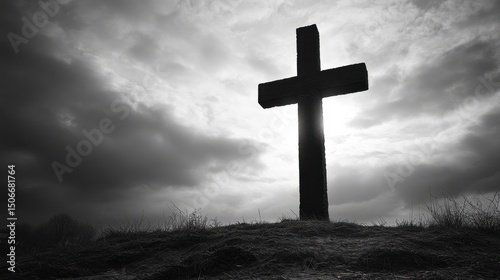 Dramatic Black and White Cross Silhouette Against Cloudy Sky