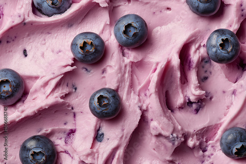Top view of blueberry fruits in pink creamy yoghurt