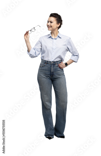 Full length portrait of an attractive smiling businesswoman standing and looking at camera isolated over transparent background