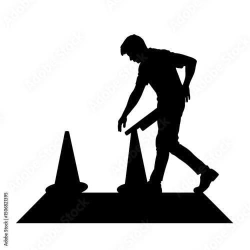 Silhouette of Person Placing Safety Cone on Floor, Caution and Prevention