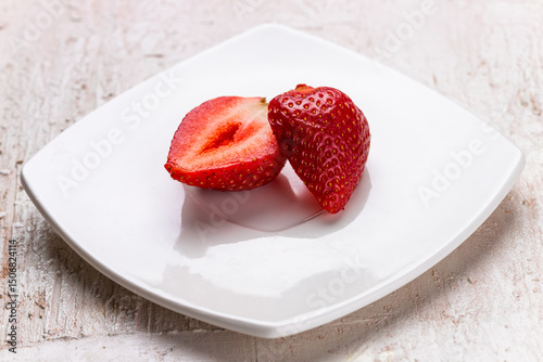 Sliced Strawberry on White Plate – Close-Up