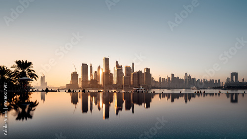 Photography the skyline of the reflected dubai marina during sunrise