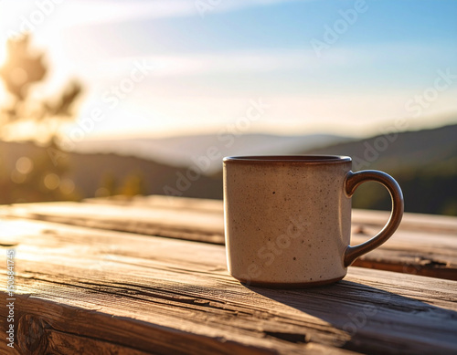 A lone textured ceramic mug sits on a bare wooden table, highlighting tactile simplicity and character.