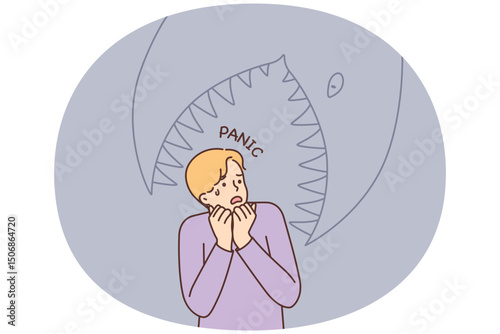Frightened man having panic attack imagining giant fish trying to eat him