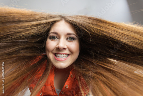 Happy positive woman with long brown hair